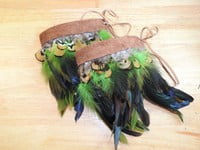 Green feathers, brown feathers, brown leather