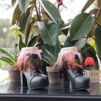 Light pink feathers, one peacock feather, off white base