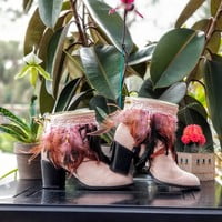 Light pink feathers, one peacock feather, off white base