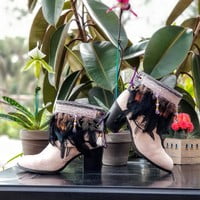 Black feathers, Small orange feathers,  grey pleather, purple lace with beads,