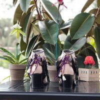 Black feathers, Small orange feathers,  grey pleather, purple lace with beads,