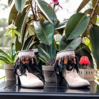 Black feathers, Small orange feathers,  grey pleather, purple lace with beads,