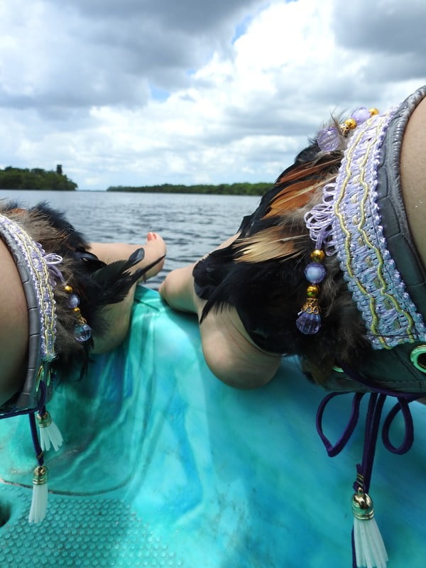 Black feathers, Small orange feathers,  grey pleather, purple lace with beads,